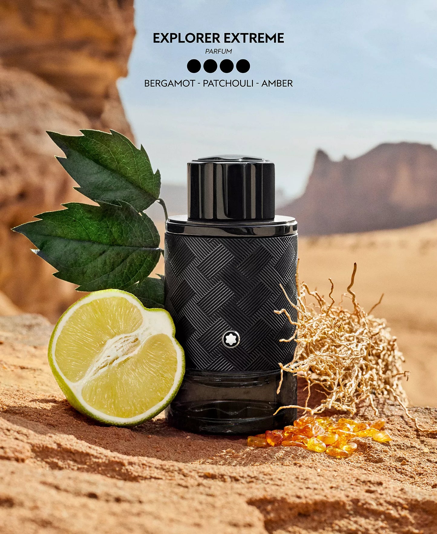 Black perfume bottle with desert elements and 'Explorer Extreme' text