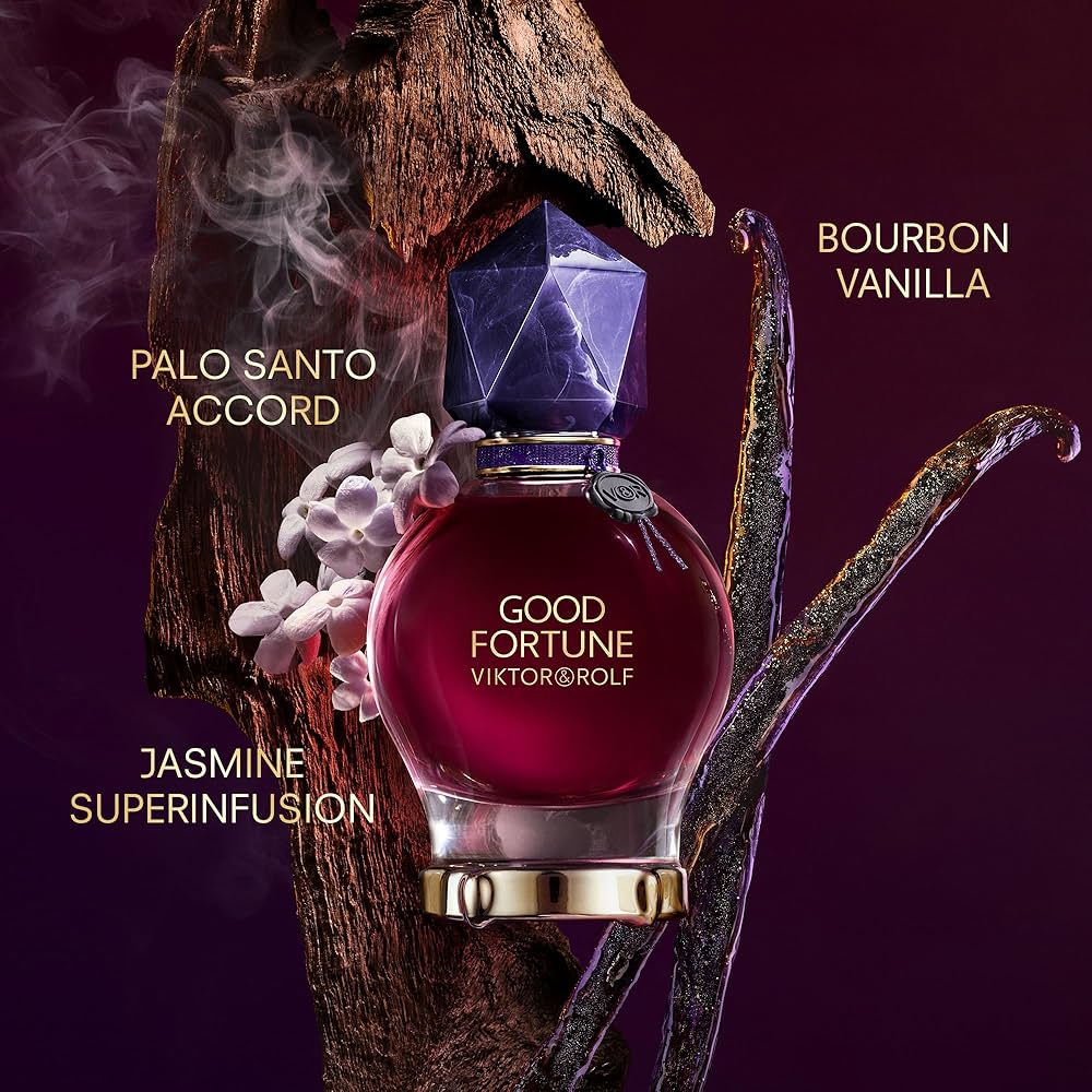 Perfume bottle labeled 'Good Fortune' by Viktor & Rolf with floral and wooden elements on a dark background.