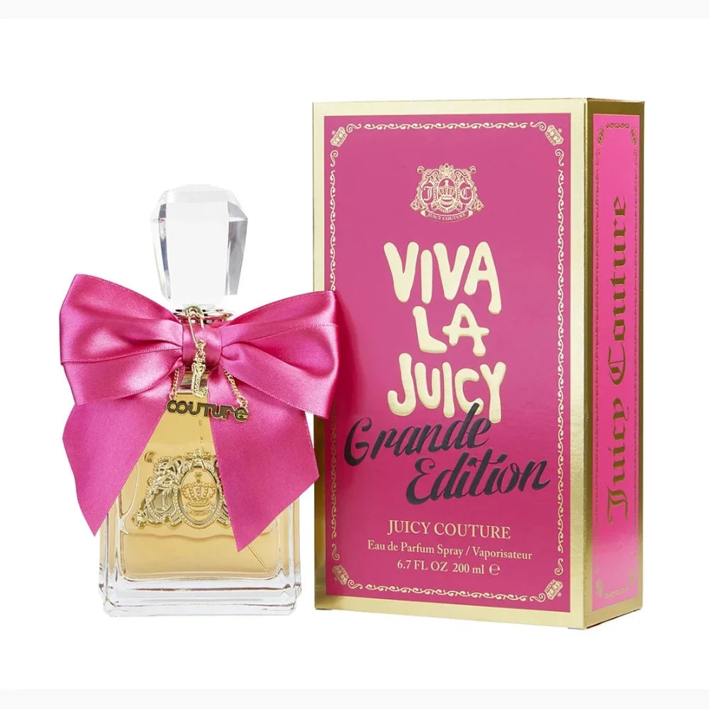 Juicy Couture Viva La Juicy Granite Edition perfume bottle and packaging with a pink bow on a white background.