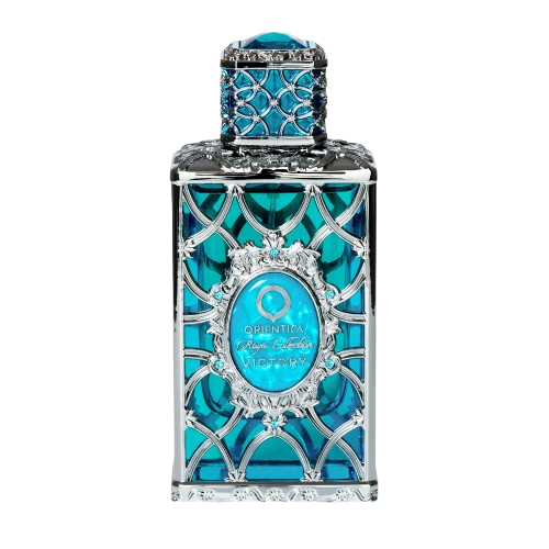 Decorative blue perfume bottle with intricate design on a white background