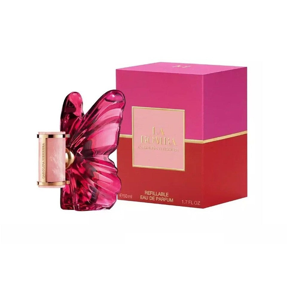Pink butterfly-shaped perfume bottle with matching box on a white background