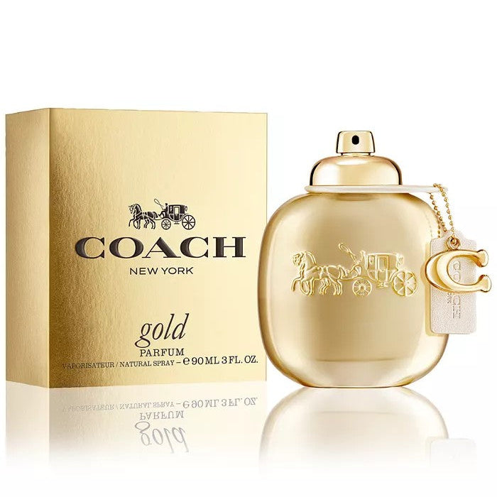Coach gold perfume bottle and packaging on a white background