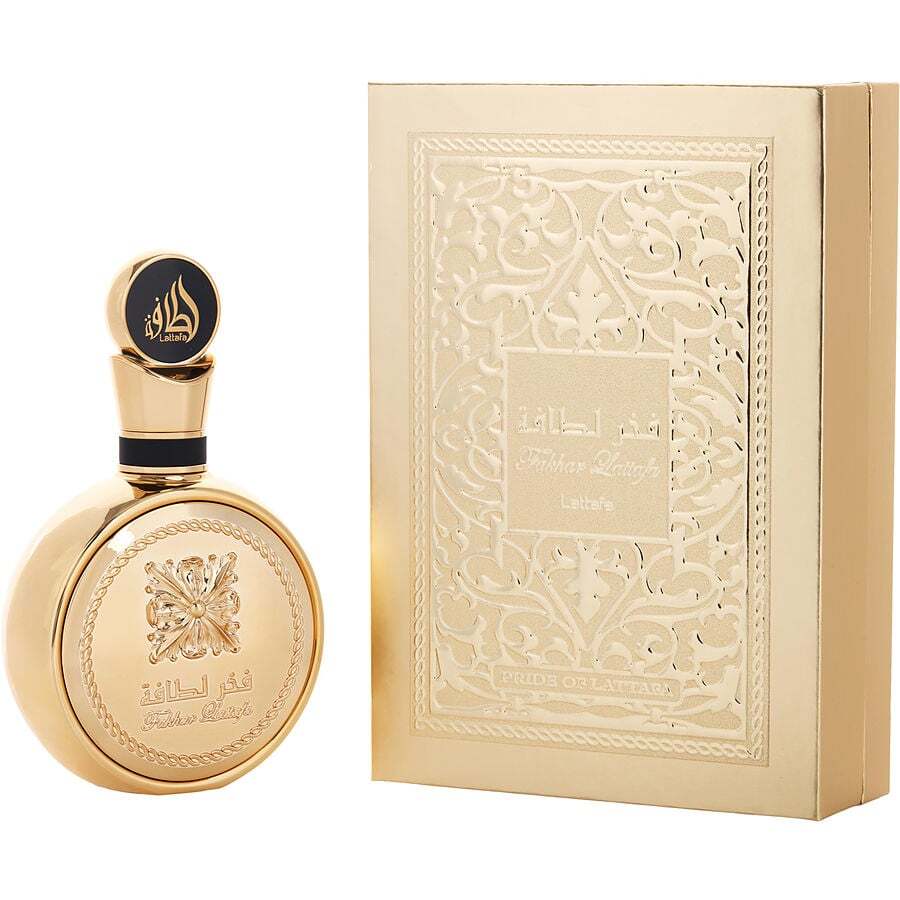 Gold perfume bottle and packaging with intricate designs on a white background