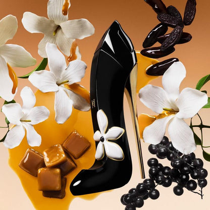 Black high-heeled shoe with white flowers on a decorative background with flowers and chocolates.