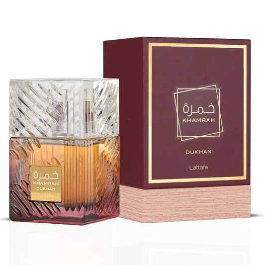 Perfume bottle and packaging of Khamrah Dukhan by Lattafa on a white background