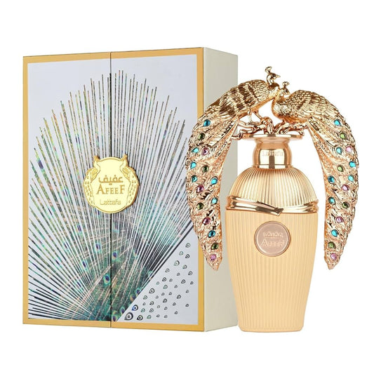 Luxurious perfume bottle with decorative wings and packaging featuring a peacock design.