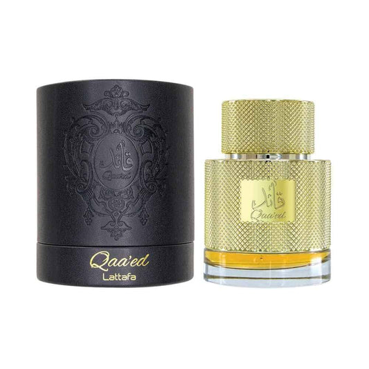 Black and gold perfume bottle with decorative design on a white background