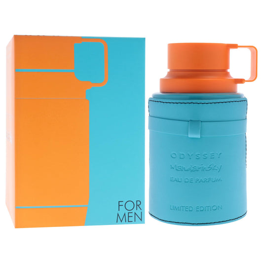 Blue and orange Odyssey perfume bottle and packaging on a white background