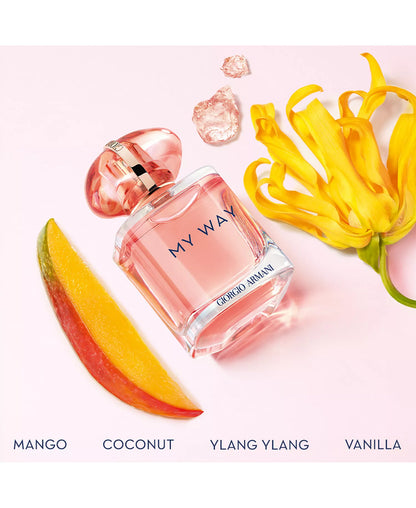 Giorgio Armani My Way perfume bottle with fruit slices on a pink background